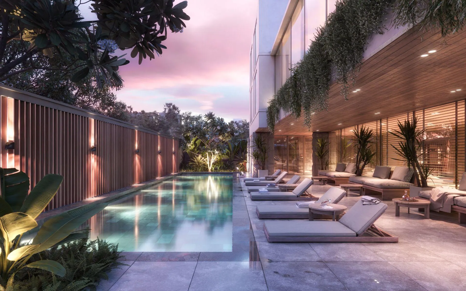 The Albany garden pool at dusk with sun loungers