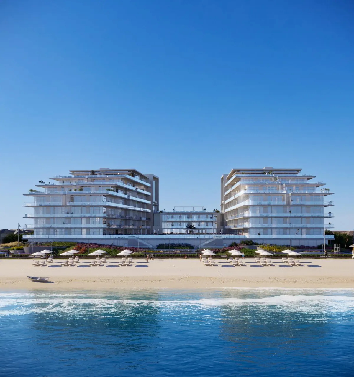 The glass facade facing the beach and cabanas