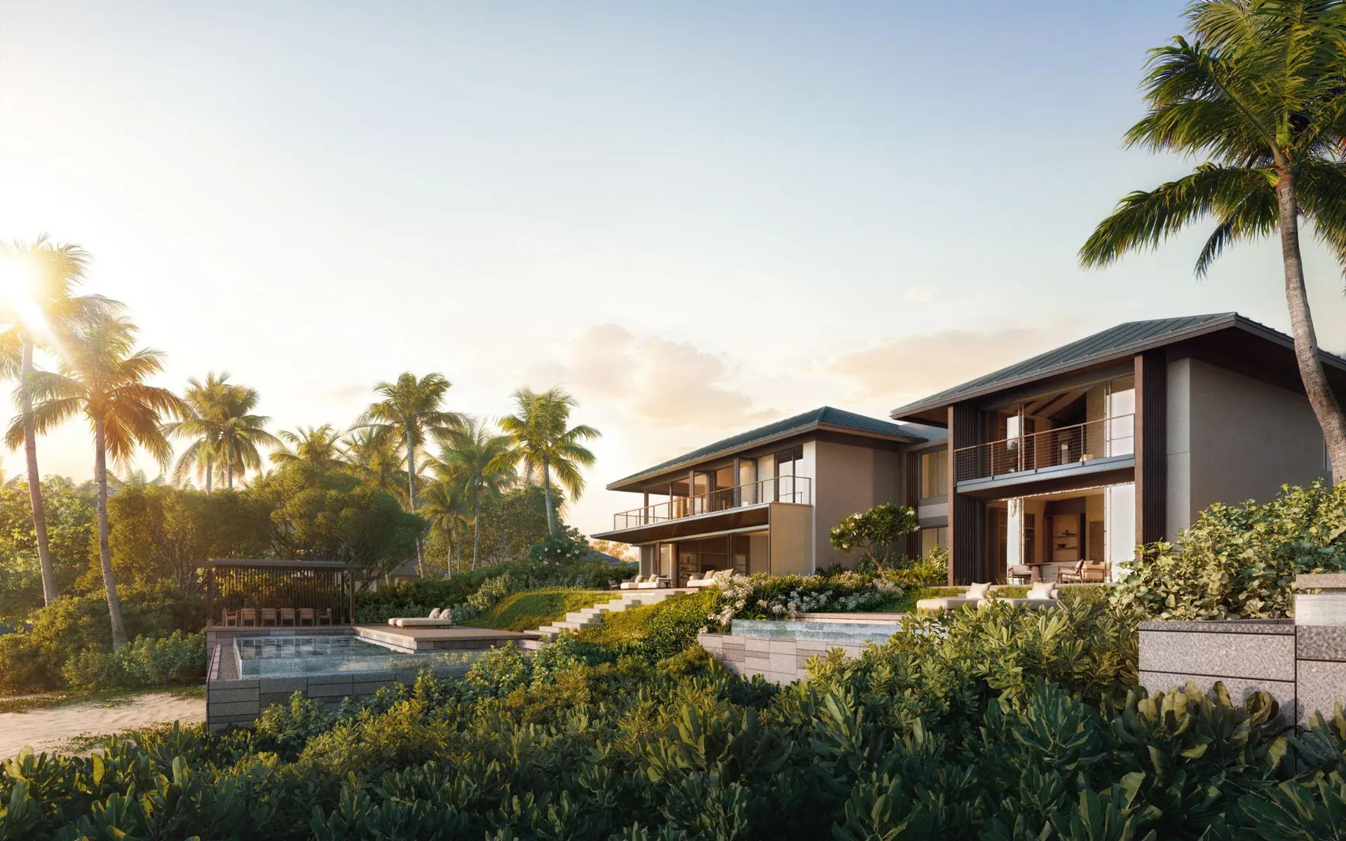 Villas set into the hillside among palms