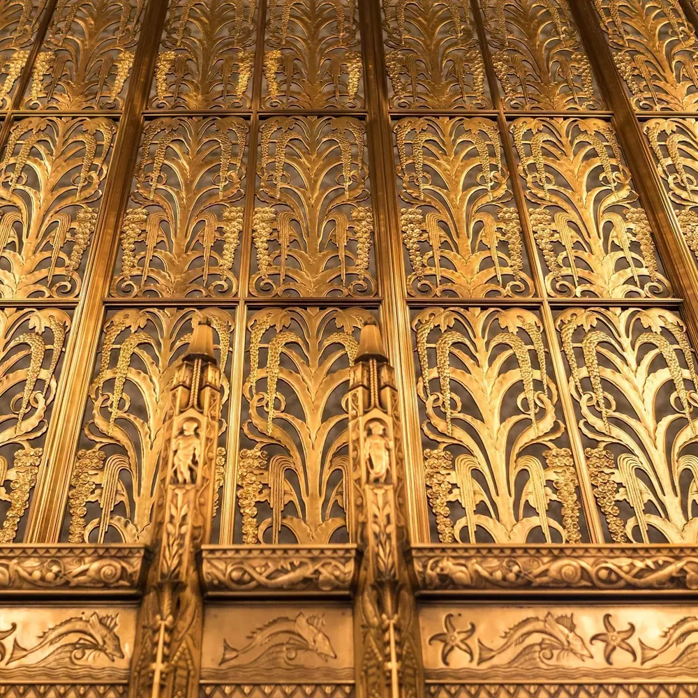 Gilded Art Deco relief detail in the 100 Barclay lobby