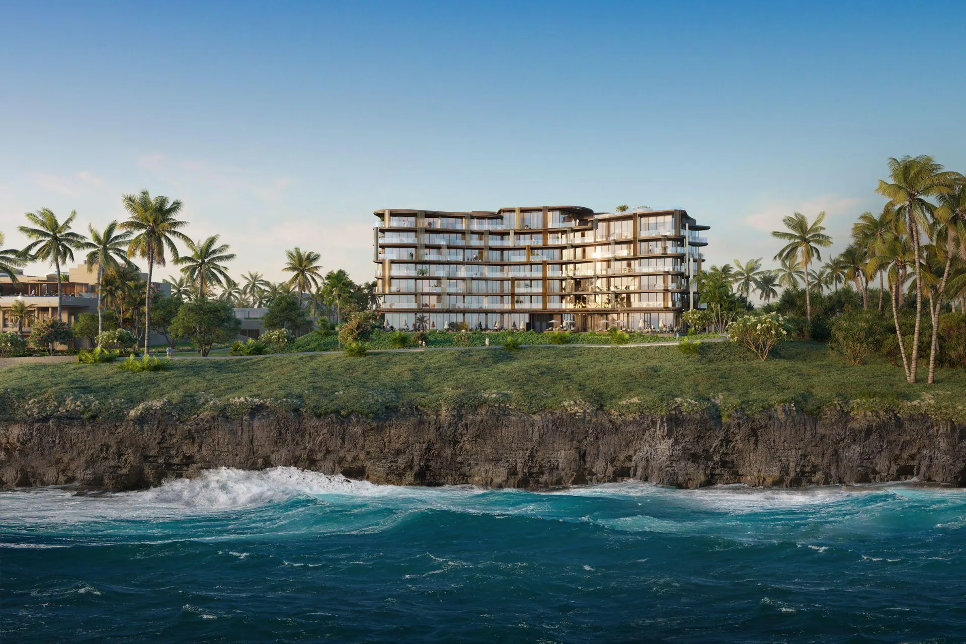 The residences above a rocky shore and breaking waves