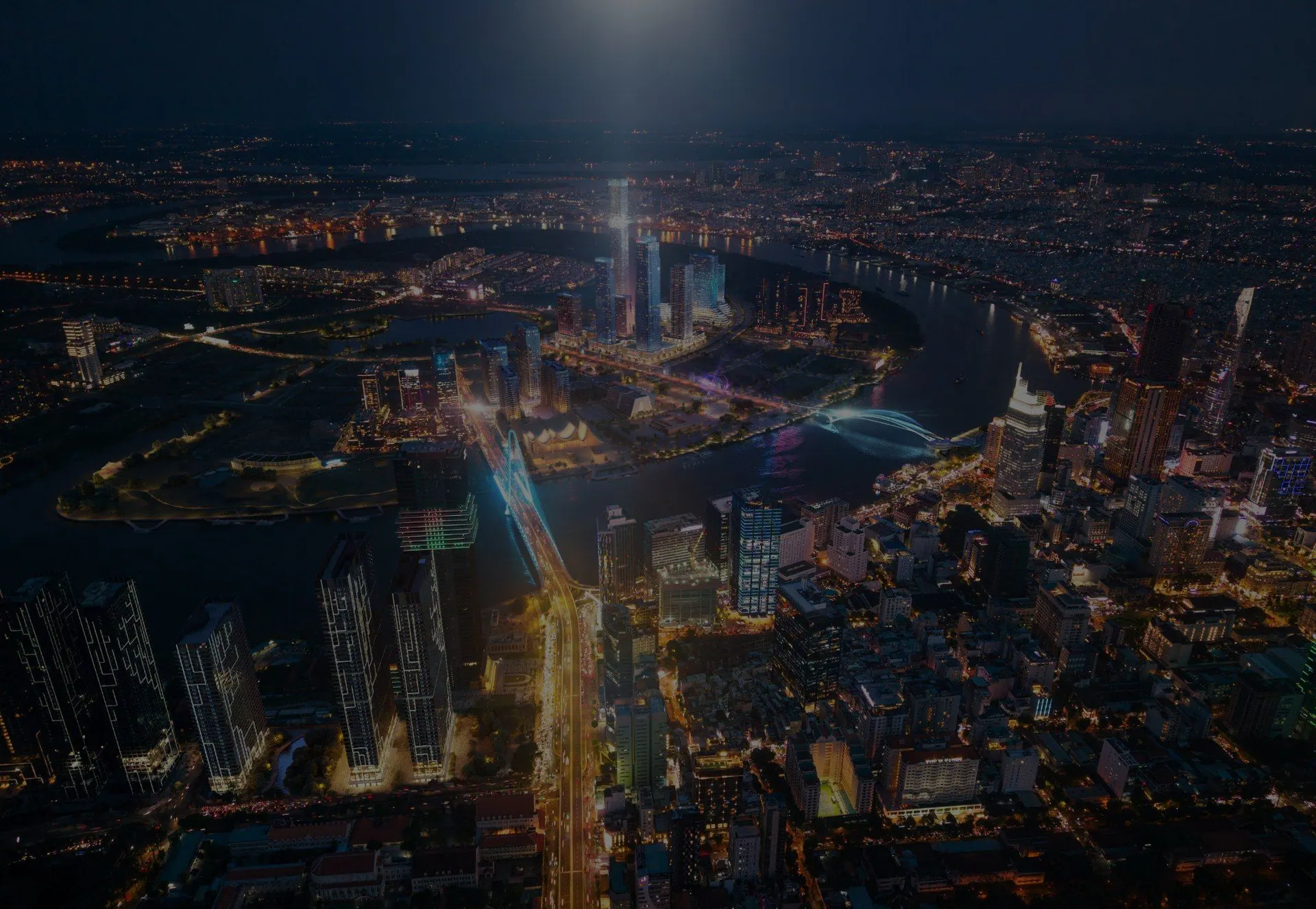 Ho Chi Minh City at night from above, the river lit by the skyline