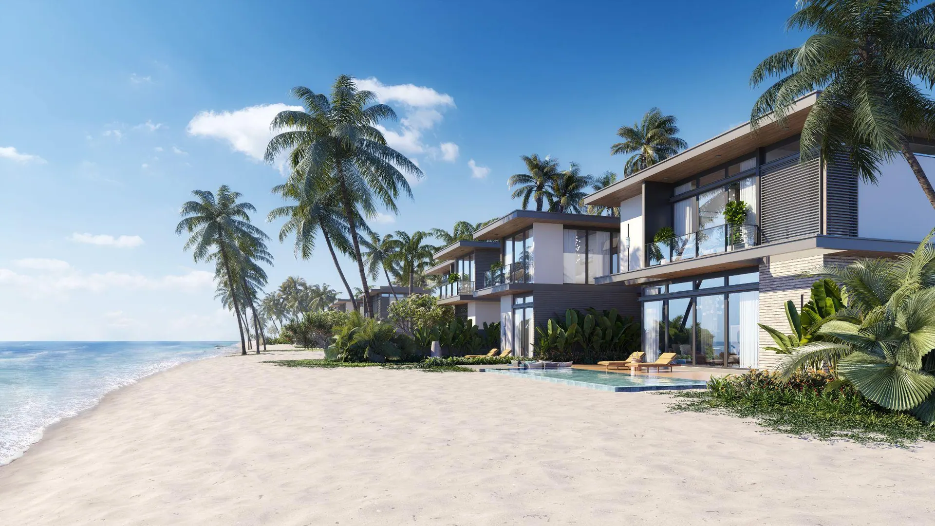 Beachfront villas behind white sand and palms