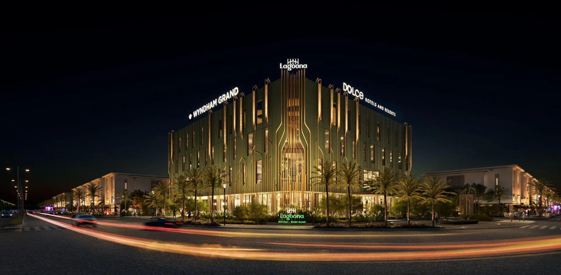 The Wyndham Grand arrival building lit at night