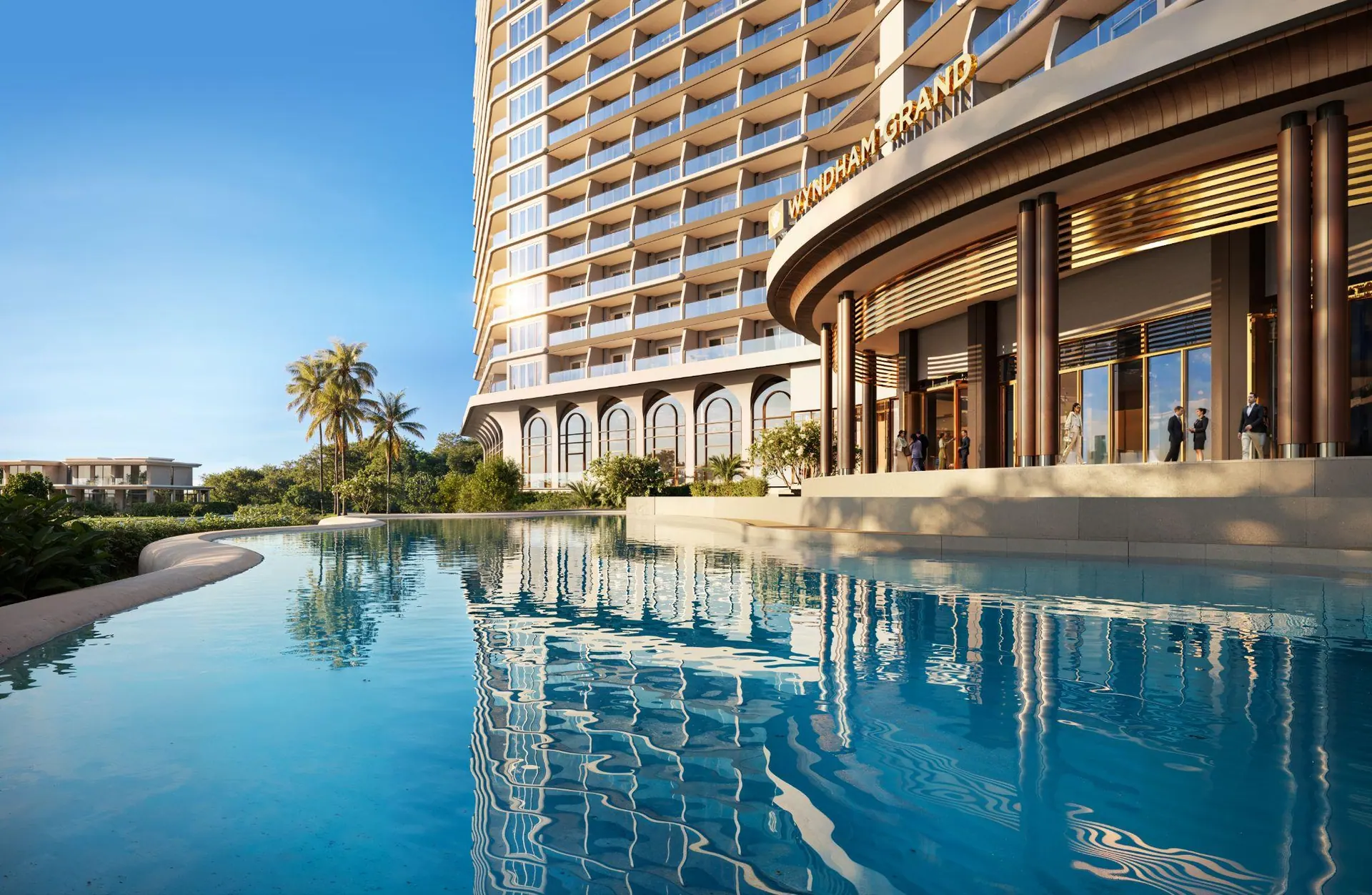 The hotel pool and tower under a clear sky