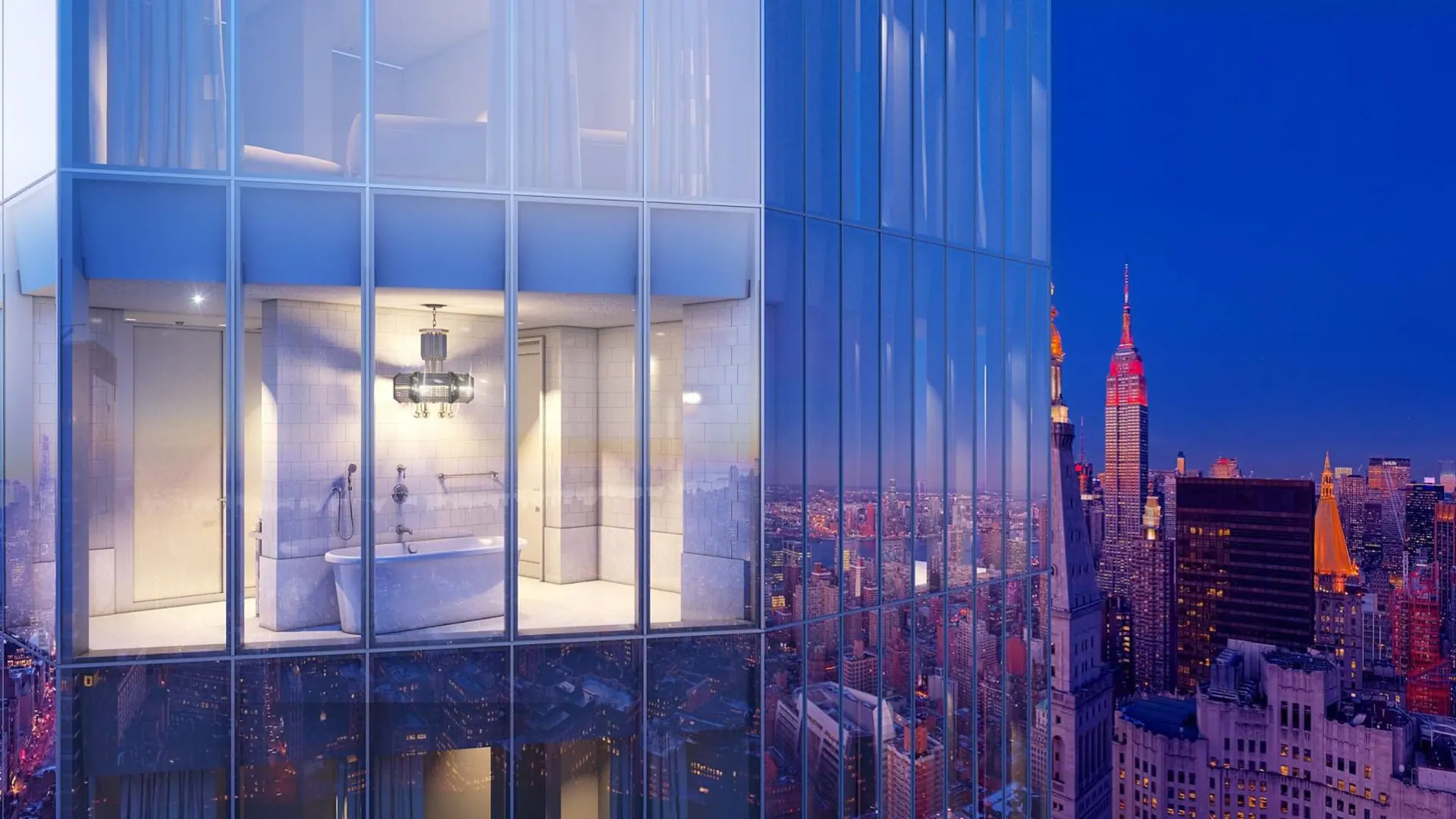The top of Madison Square Park Tower glowing above the Manhattan skyline