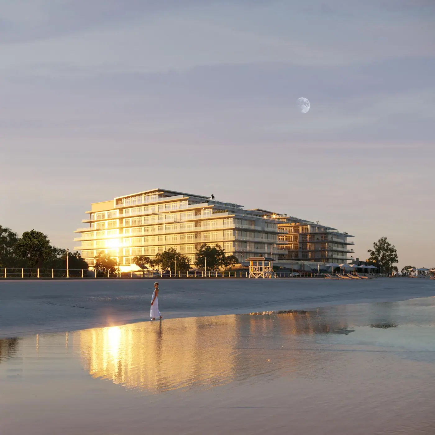 Film frame: a beachfront building glowing at sunset, reflected in wet sand