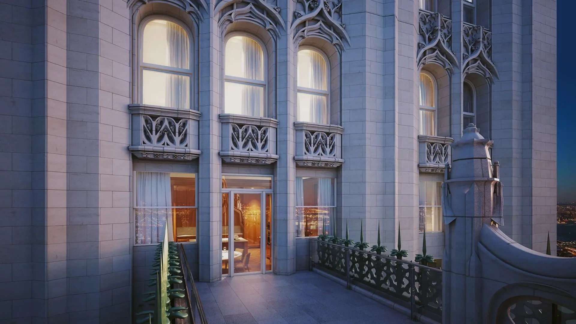 Gothic stonework and a terrace high on the Woolworth Building at dusk