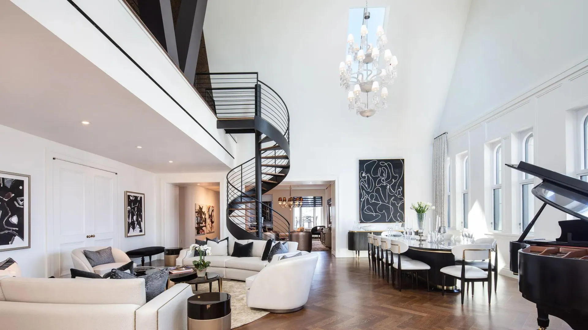 A double-height Woolworth residence with a spiral stair and grand piano